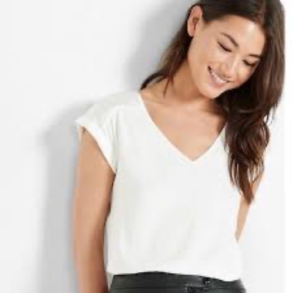 Off-White Satin Blouse with rolled sleeve.